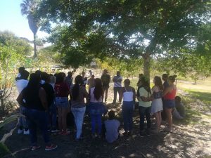 Yoliswa, permaculture teacher, introduces the students to the garden